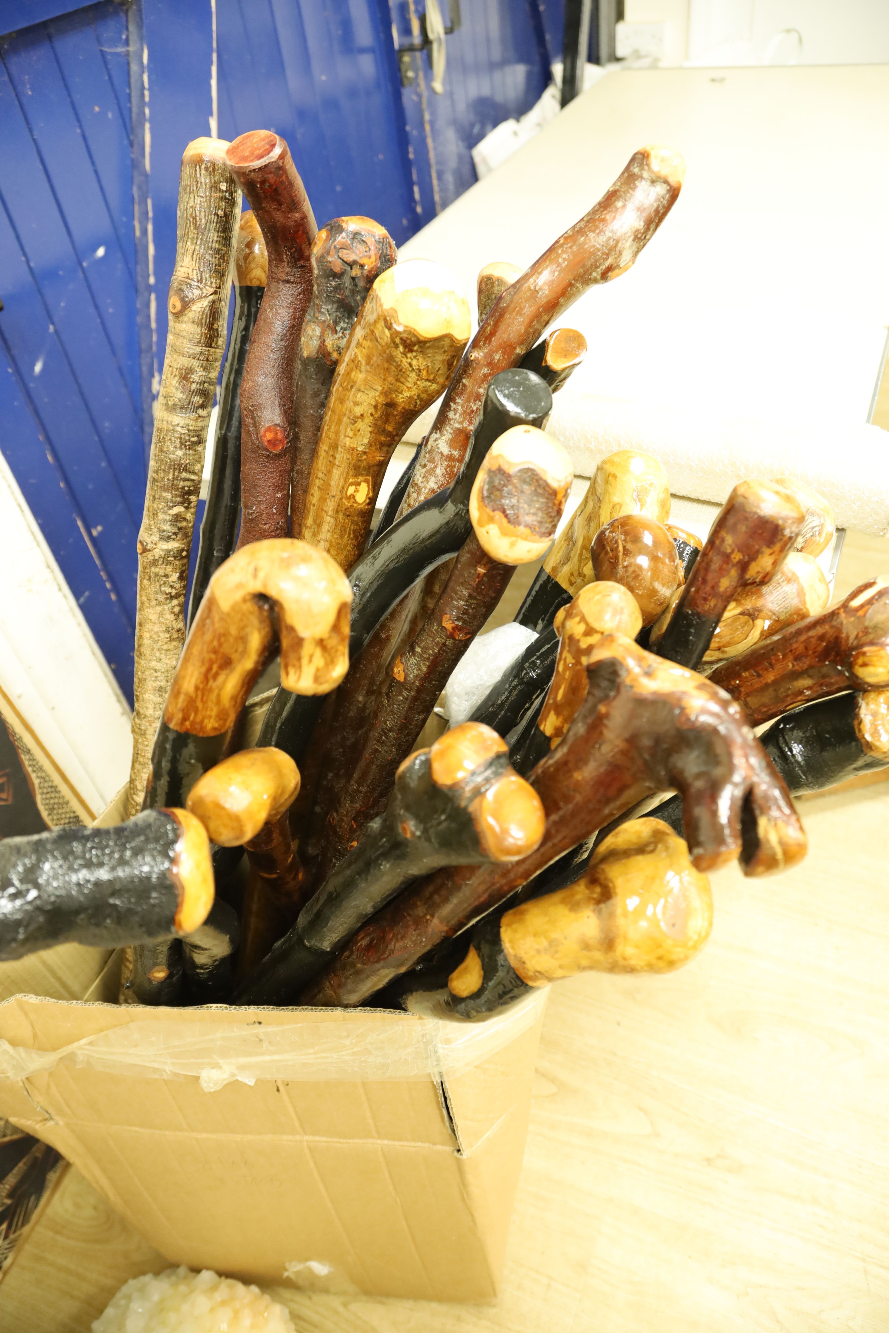 Approximately twenty two assorted provincial wood walking canes